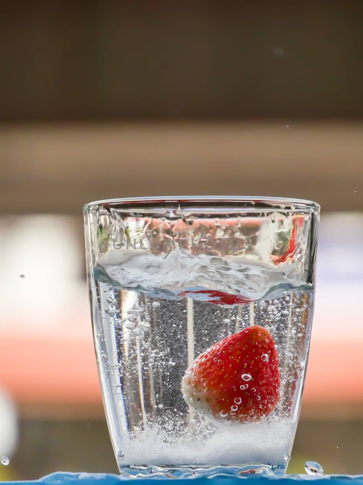 Strawberry Water splash in glass by nikky1972