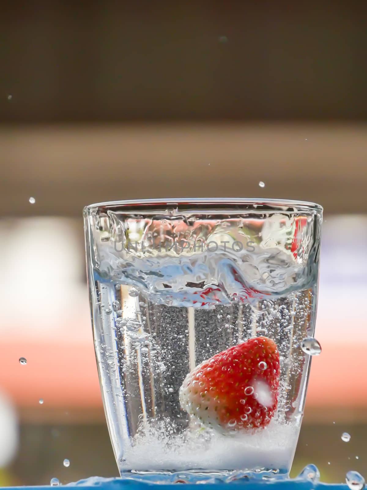 Strawberry Water splash in glass by nikky1972