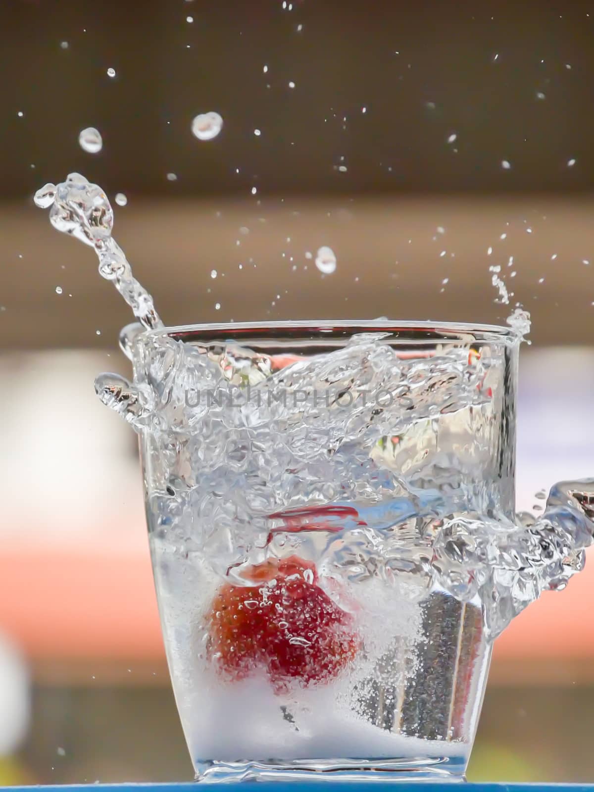 Strawberry Water splash in glass by nikky1972