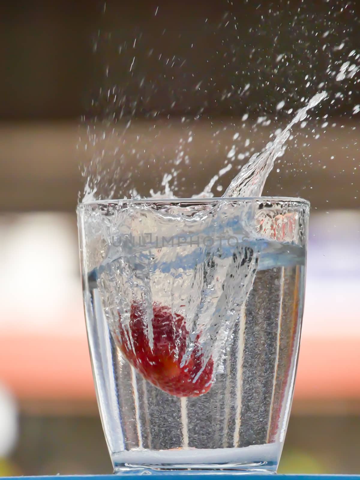 Strawberry Water splash in glass by nikky1972