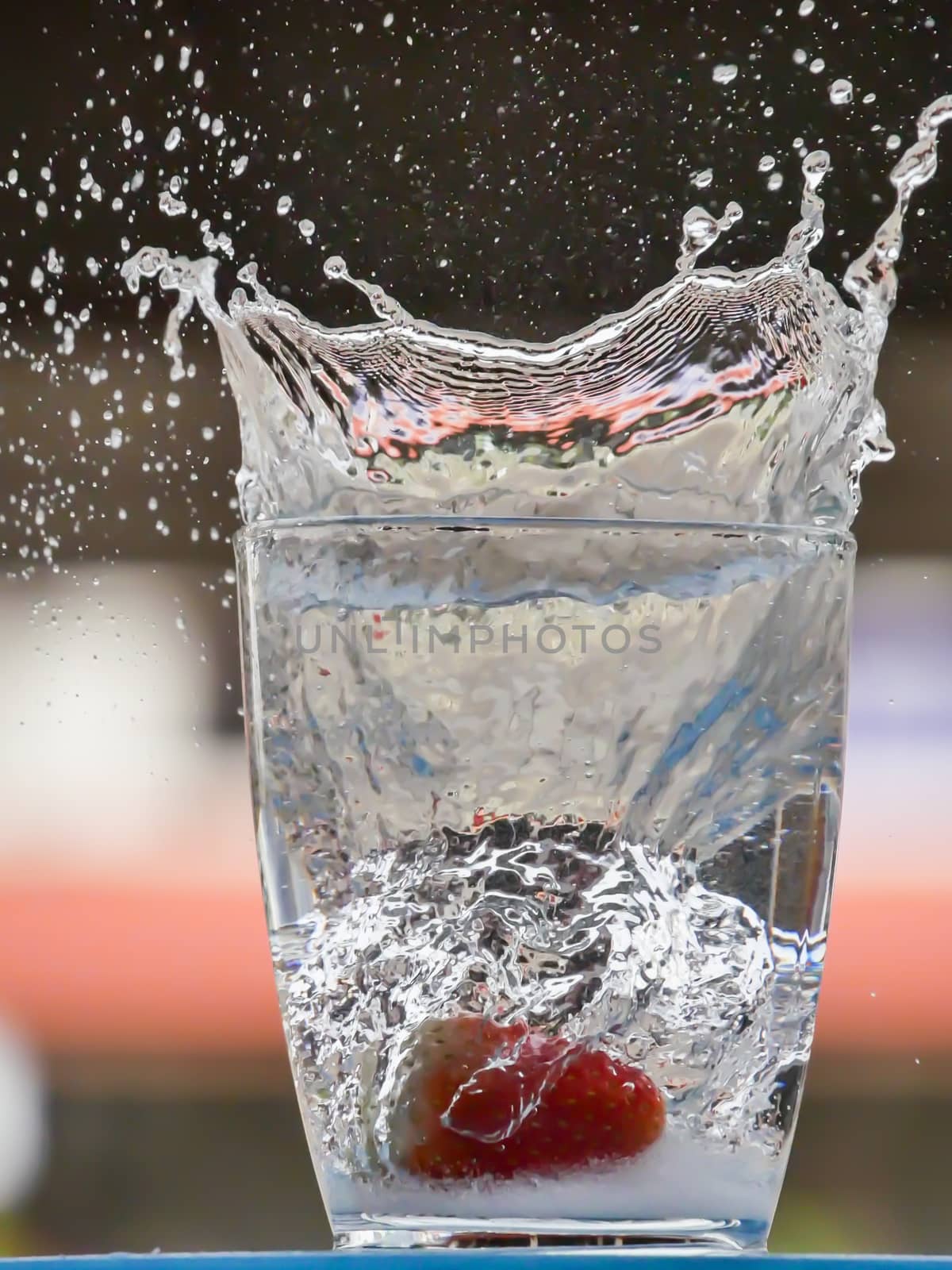 Strawberry Water splash in glass by nikky1972