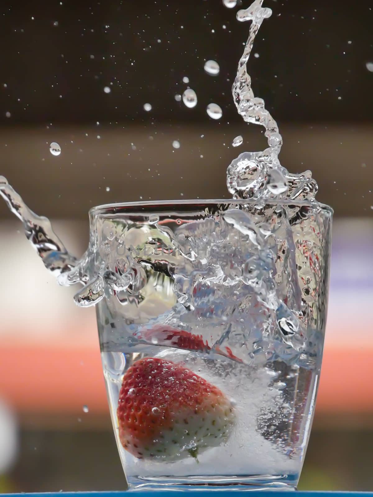 Strawberry Water splash in glass by nikky1972