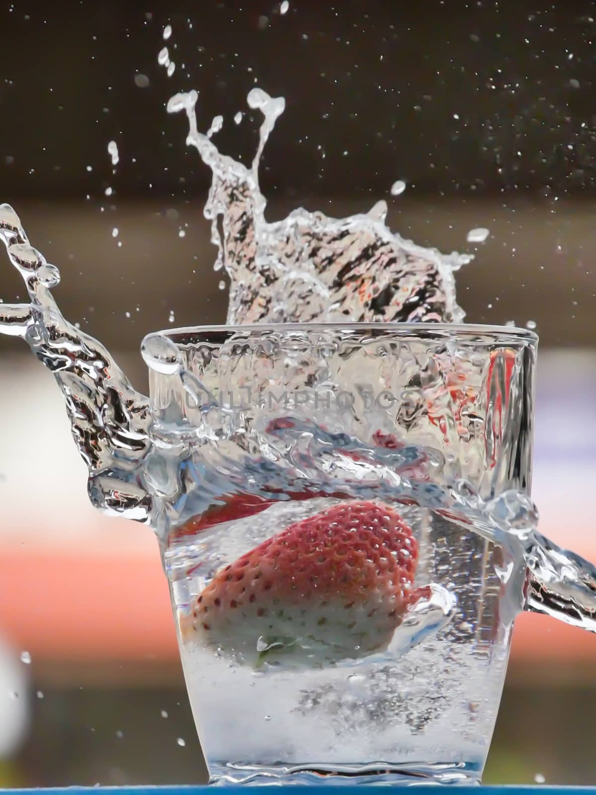 Strawberry Water splash in glass by nikky1972