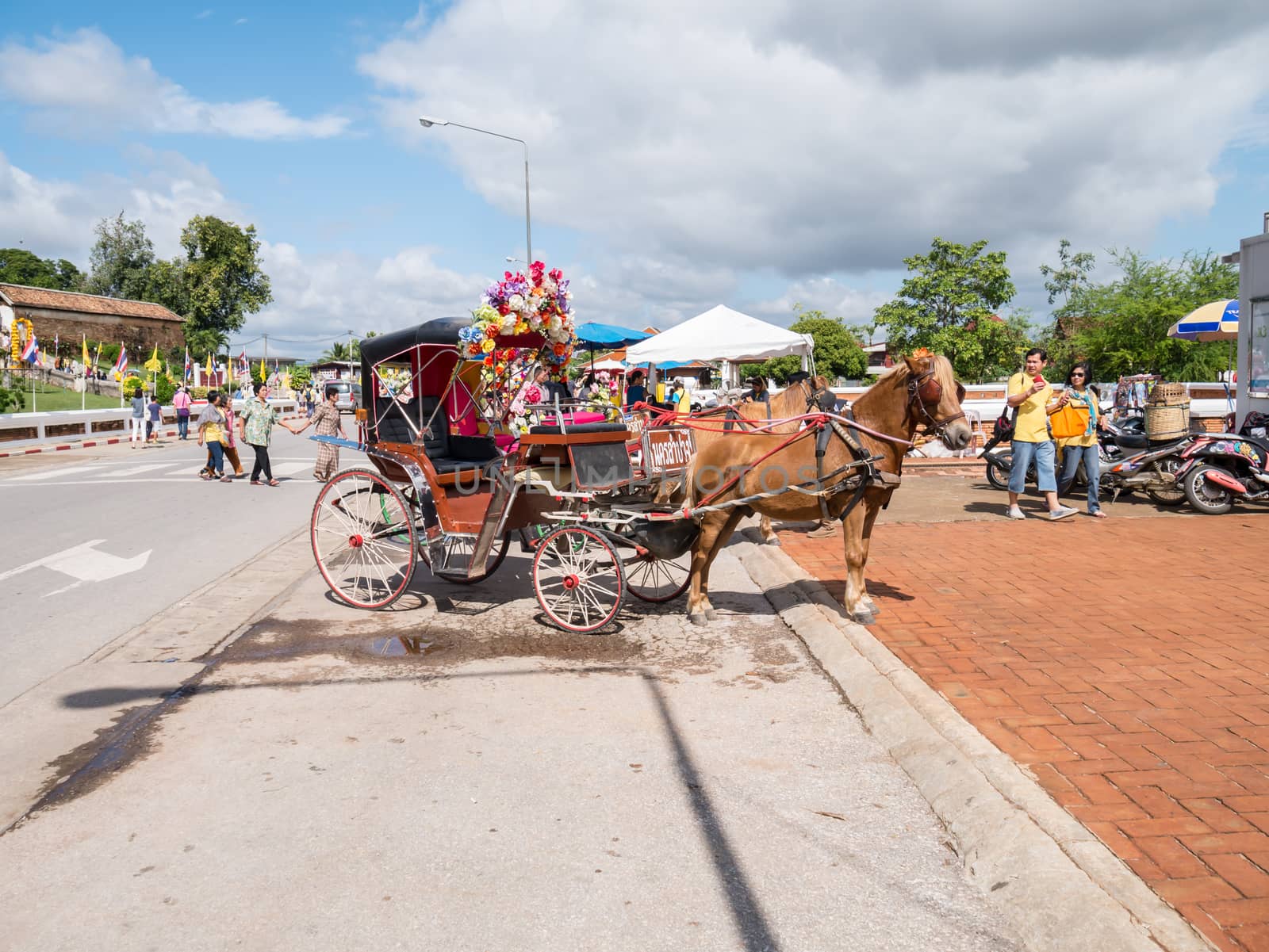 Lampang - December 5 : Don Muang Airport on December 5 , 2015 People in holiday  travel which horse carriage in temple Phrathat Lampang Luang in Lampang, Thailand Thailand.