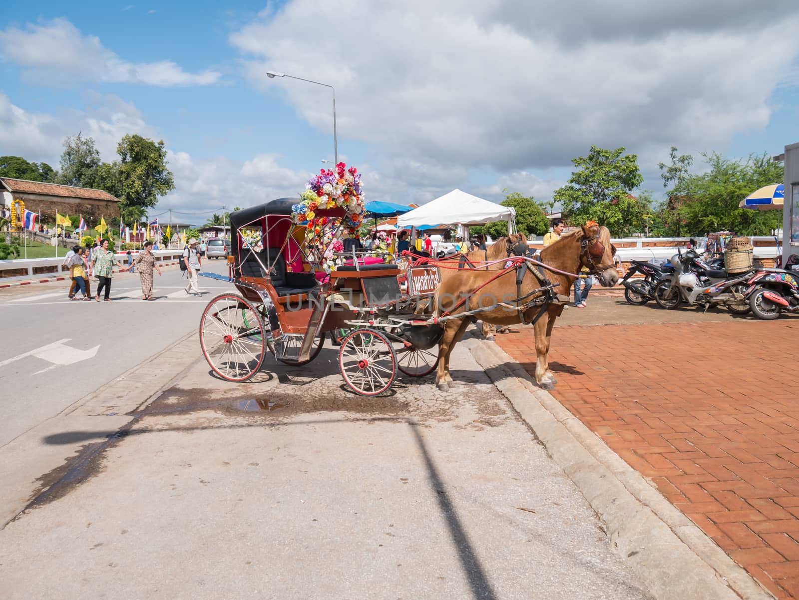 Lampang - December 5 : Don Muang Airport on December 5 , 2015 People in holiday  travel which horse carriage in temple Phrathat Lampang Luang in Lampang, Thailand Thailand.