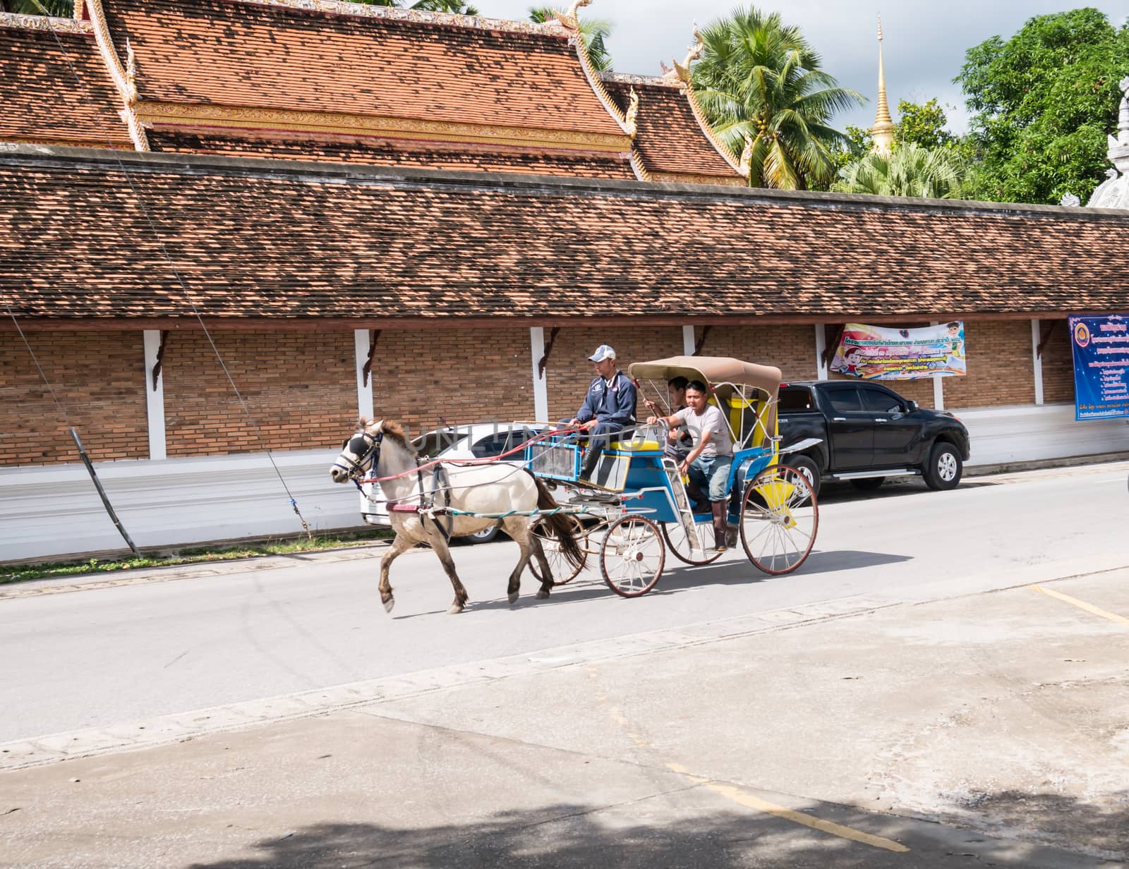 Lampang - December 5 : Don Muang Airport on December 5 , 2015 People in holiday  travel which horse carriage in temple Phrathat Lampang Luang in Lampang, Thailand Thailand.