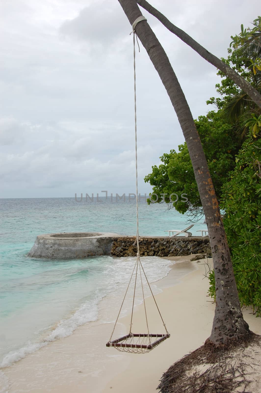 Hammock on rope at ocean beach, Maldives, Bandos Island