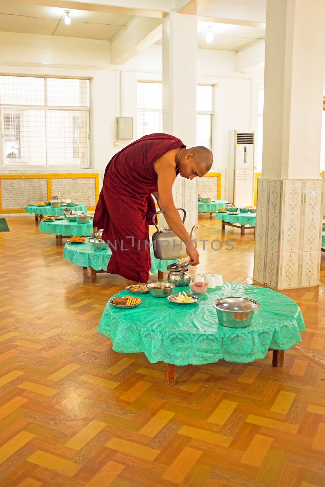 BAGO, MYANMAR -November 26, 2015: Monk serving tea in the monastery from Bago in Myanmar.
Buddhism in Myanmar is predominantly of the Theravada tradition, practised by 89% of the country's population. It is the most religious Buddhist country in terms of the proportion of monks in the population and proportion of income spent on religion

