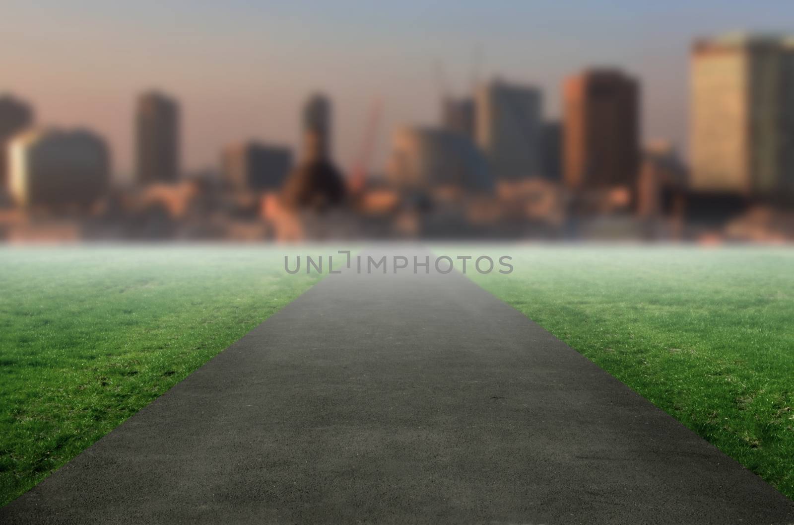 Open road with skyscrapers in the horizon