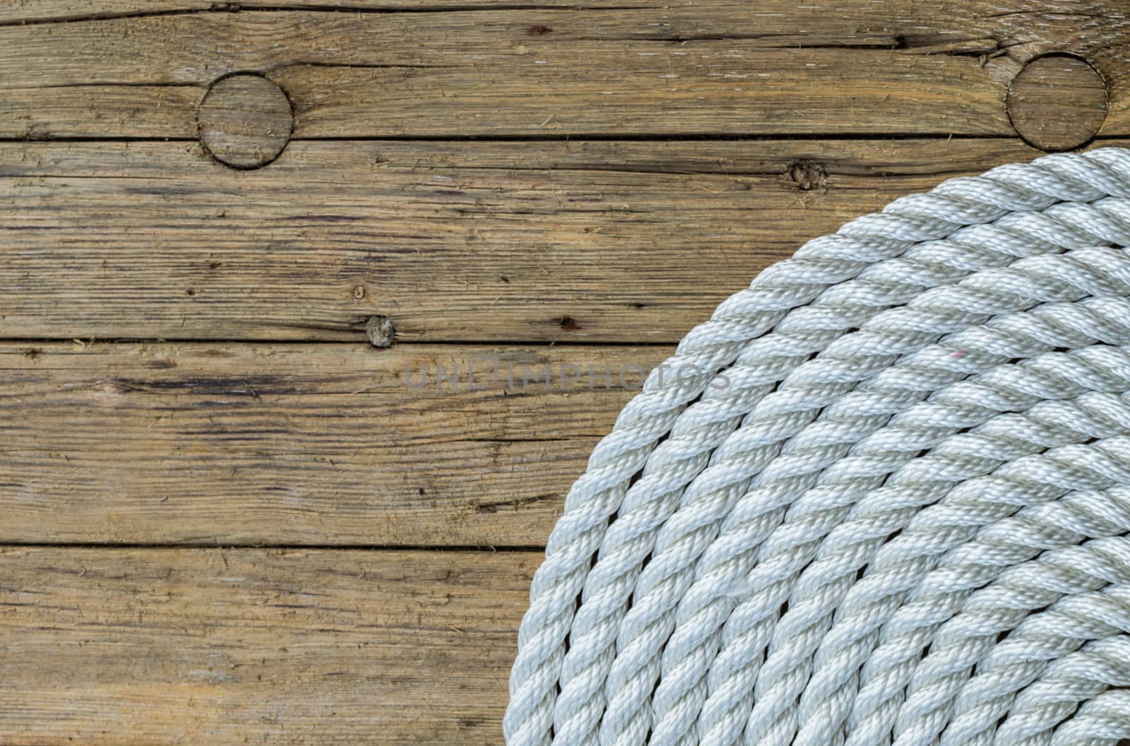 Rope Coil on wooden background  by radzonimo