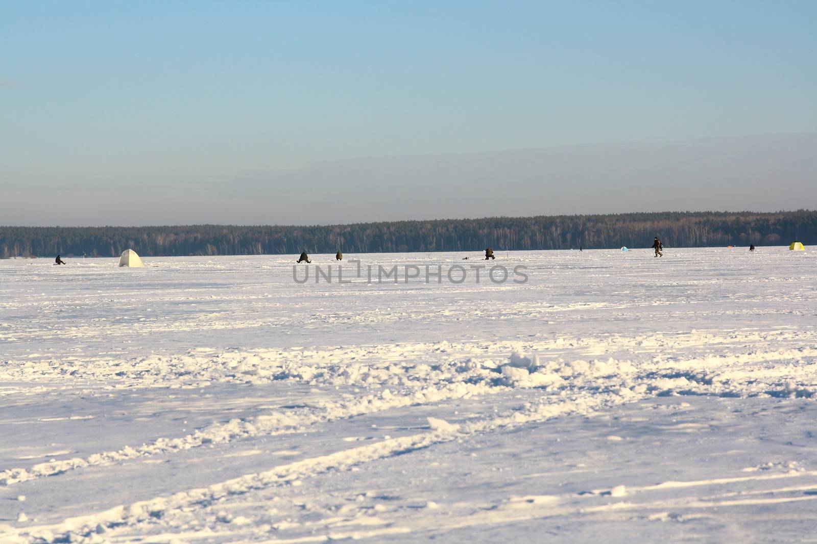 Fishermans on ice for fishing by mturhanlar