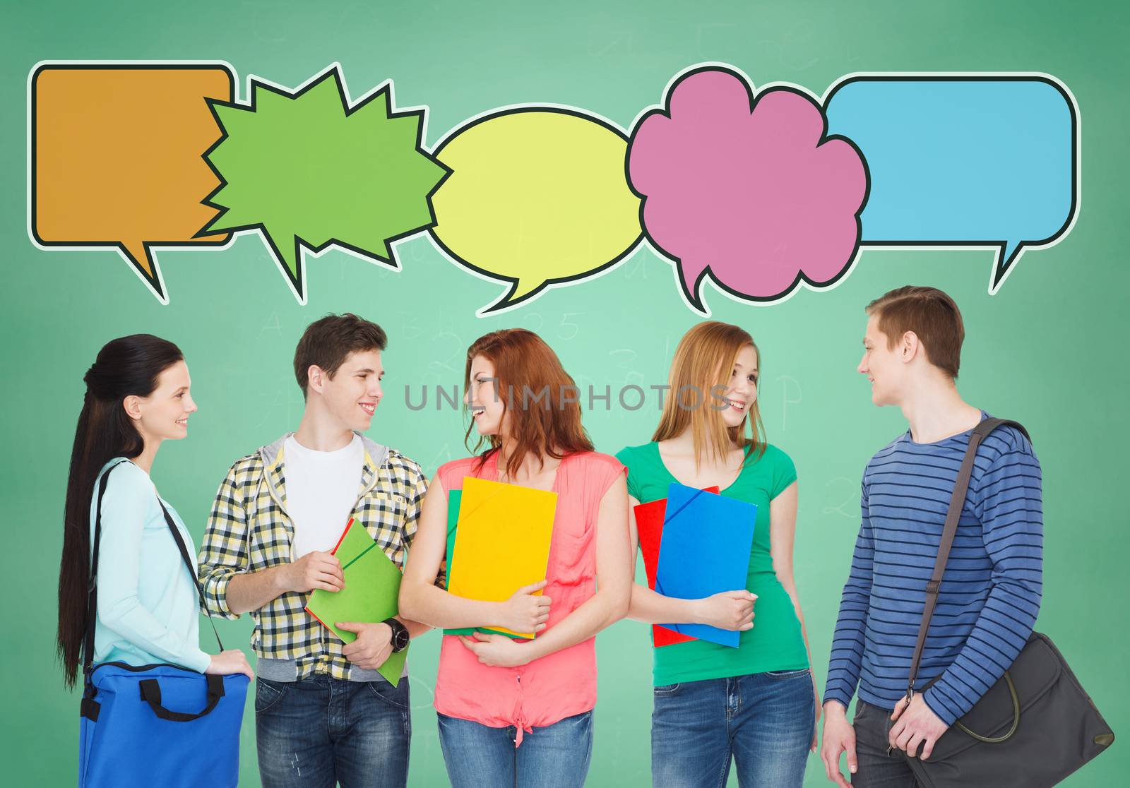 school, education, communication and people concept - group of smiling teenagers with folders and school bags talking over green board background with text bubbles