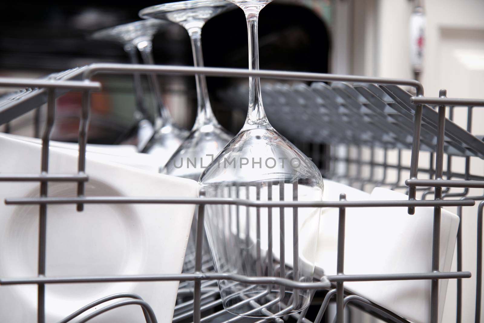 Open dishwasher with clean utensils
