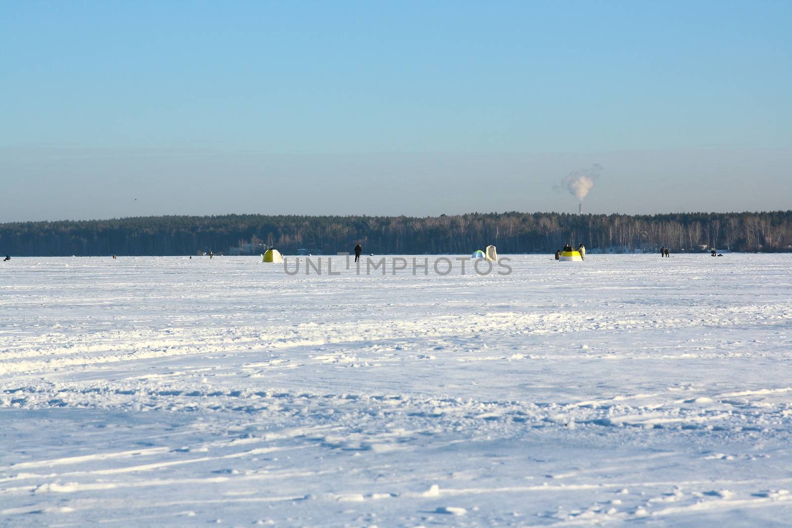 Fishermans on ice for fishing with equipments