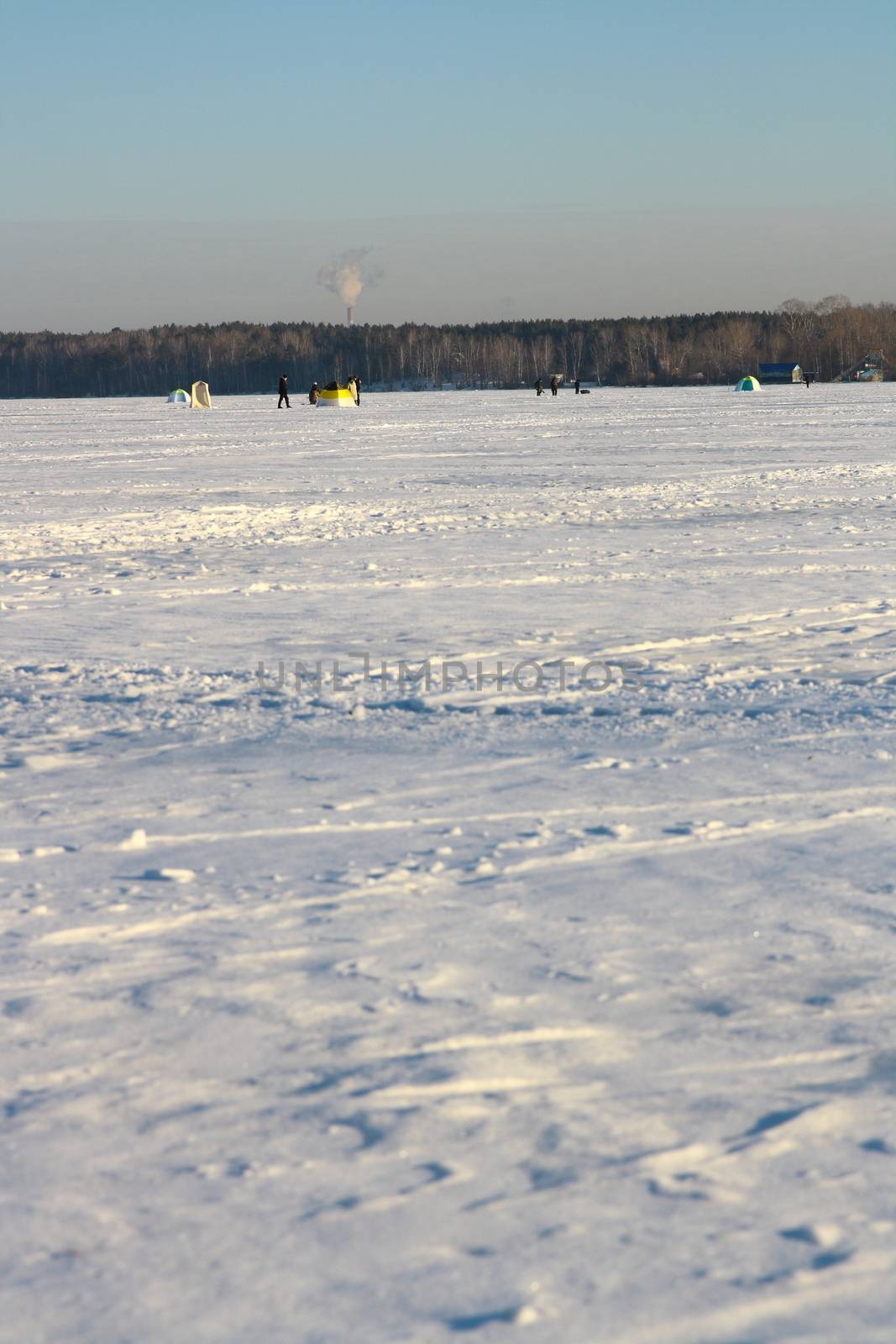 Fishermans on ice for fishing by mturhanlar