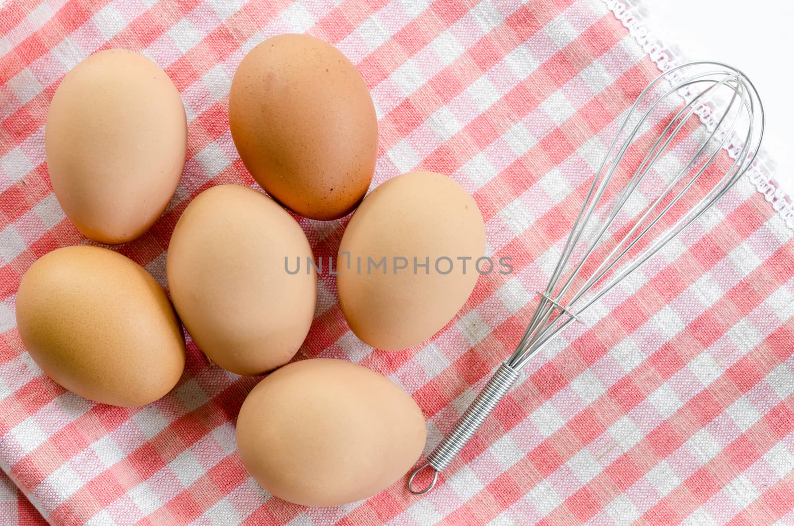 top view of eggs on tablecloth.
