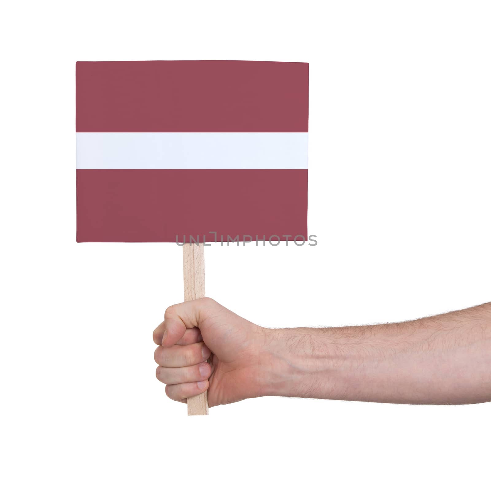 Hand holding small card - Flag of Latvia by michaklootwijk