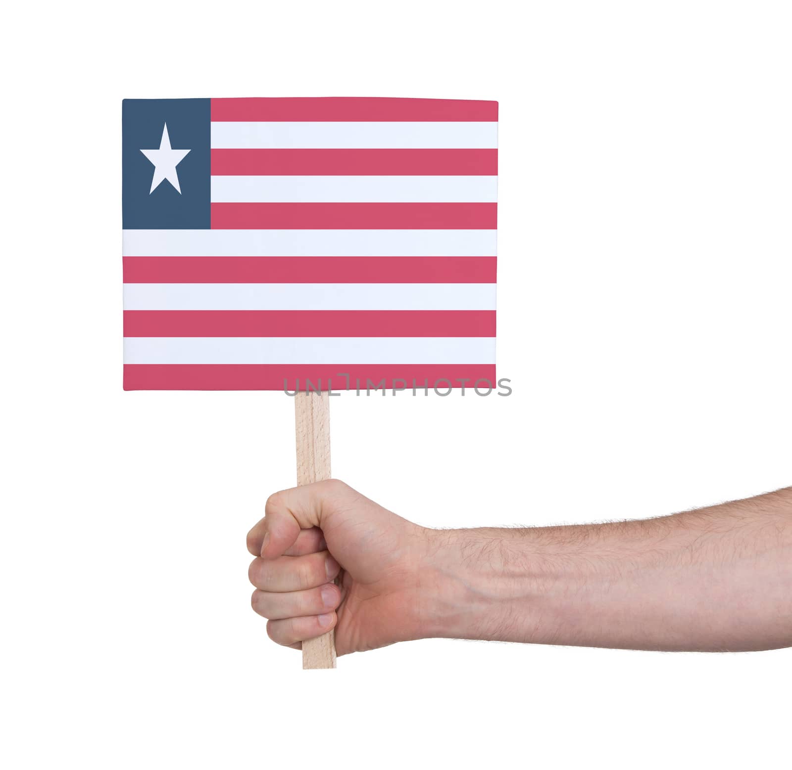 Hand holding small card - Flag of Liberia by michaklootwijk