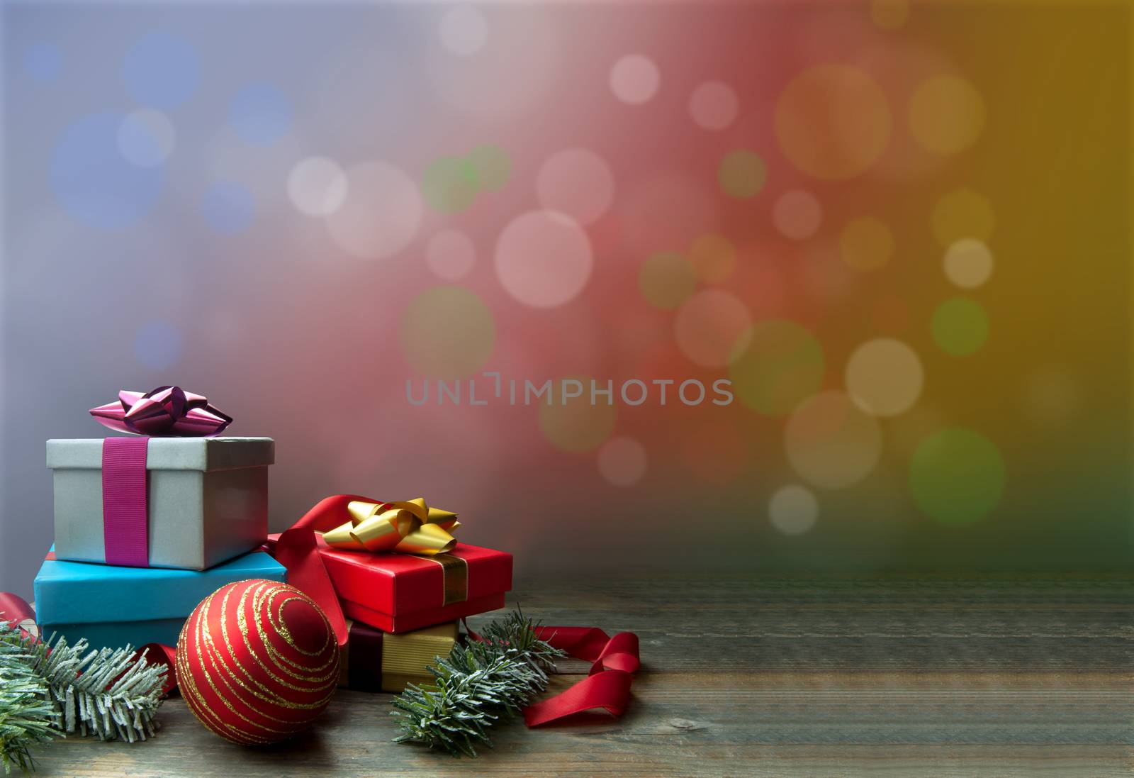 Christmas gifts and decorations with bokeh background space 