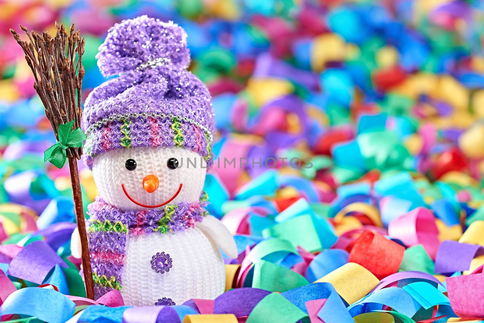 New Year 2016. Happy Snowman. Party decoration multicolored serpentine confetti. Cheerful fun winter holiday, copyspace.Snowman celebration in festive hat, scarf smiling with broom, festive background