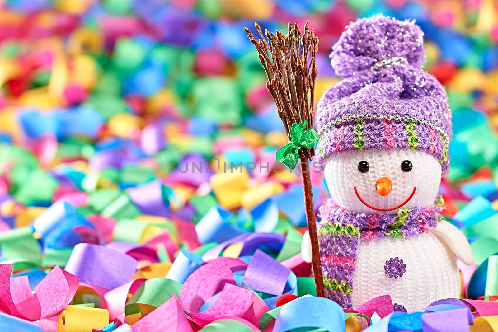 New Year 2016. Happy Snowman. Party decoration multicolored serpentine confetti. Cheerful fun winter holiday, copyspace.Snowman celebration in festive hat, scarf smiling with broom, festive background