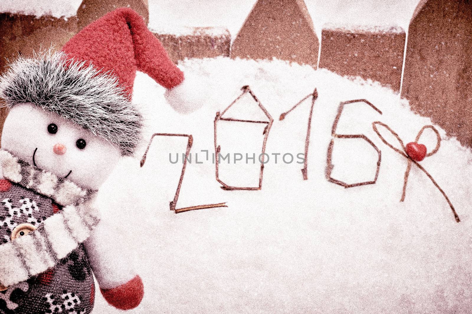 New Year 2016. Merry Christmas. Happy Snowman peeking on snow. Cheerful fun winter holiday, copyspace. Snowman celebration in Santa hat, scarf smiling. Retro, vintage, grain effect. Greeting card