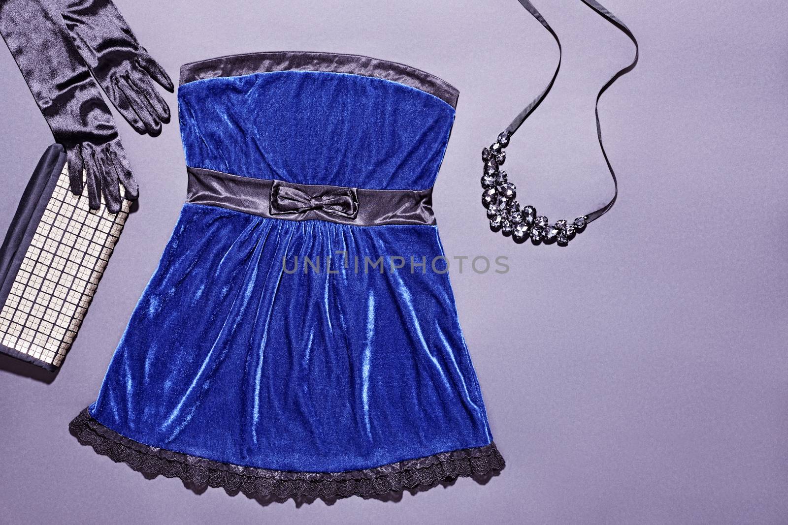 Fashion clothes stylish set, blue mini dress and accessories. Glamor creative, trendy black gloves and shiny clutch, luxury necklaces.  Unusual elegant evening party style, copyspace