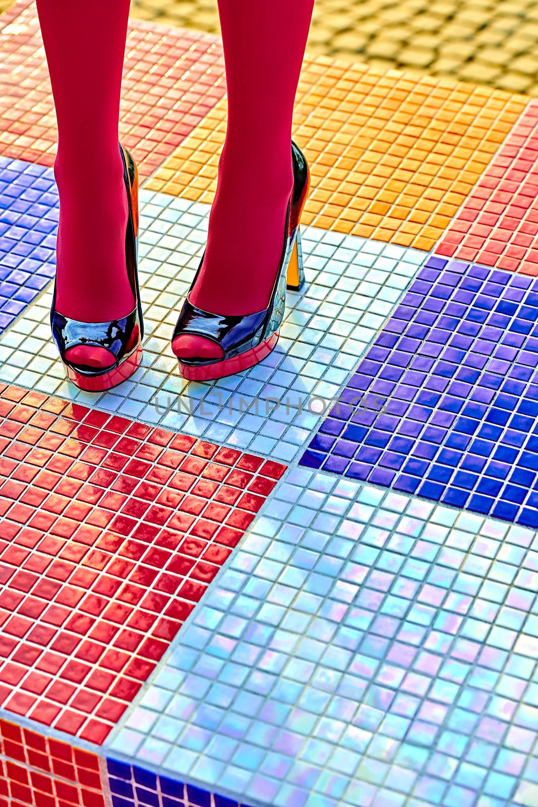 Fashion urban womens sexy legs, pantyhose, stylish heels, people. Vivid shiny multicolored geometry square pattern. Unusual, surrealism abstraction. Girl in trendy shoes, creative mosaic, outdoor