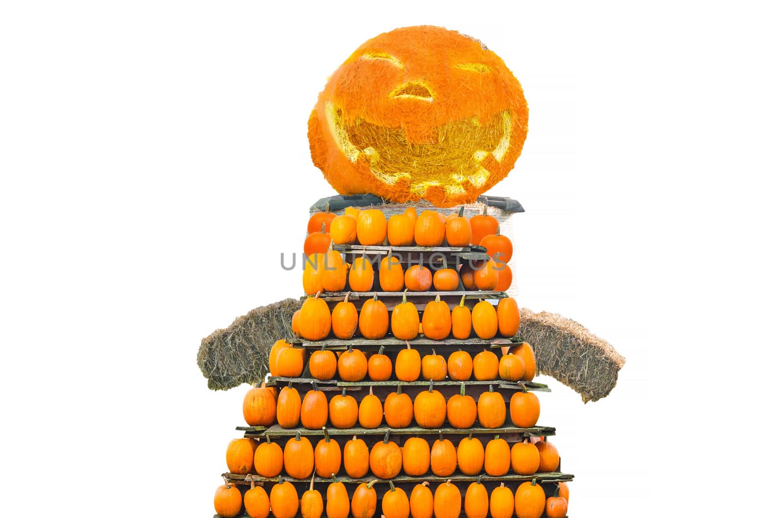 Figure of straw bales with pumpkin head and body on Halloween