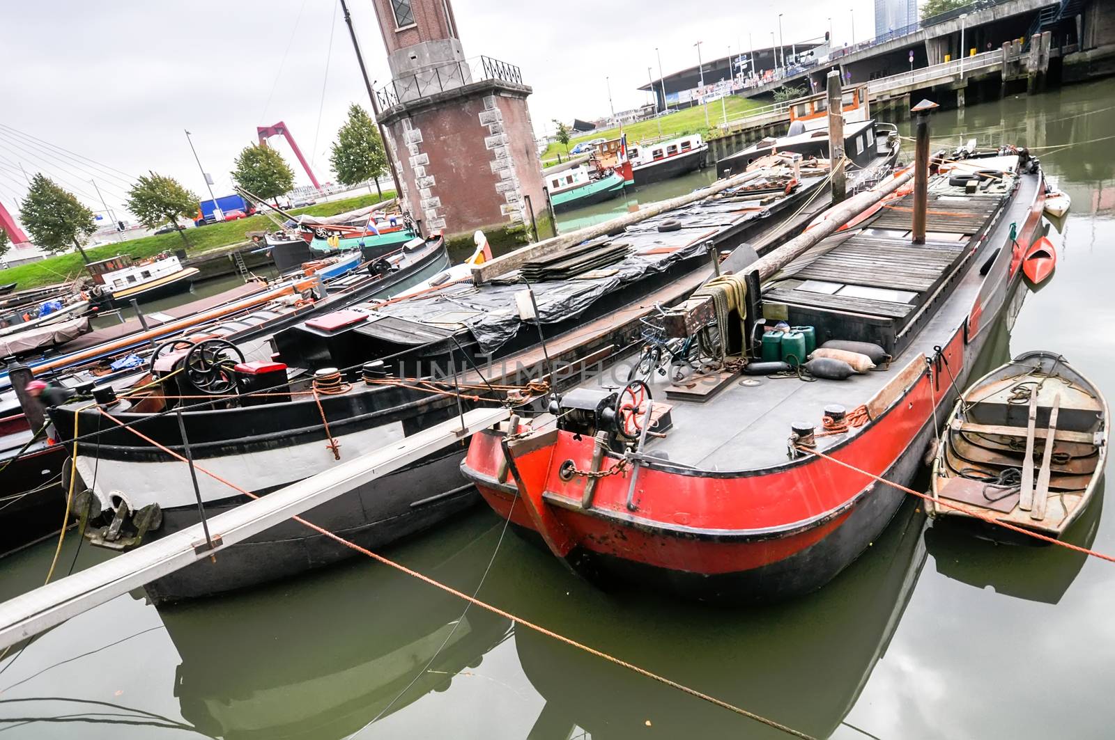 view at old boats on Rotterdam canal  by vlaru