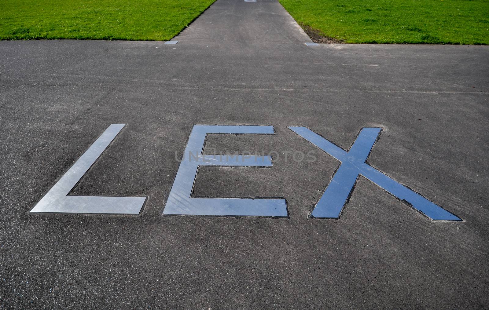 metal lettering LEX on the pavement on the promenade in front of hotel New York in Rotterdam Holland