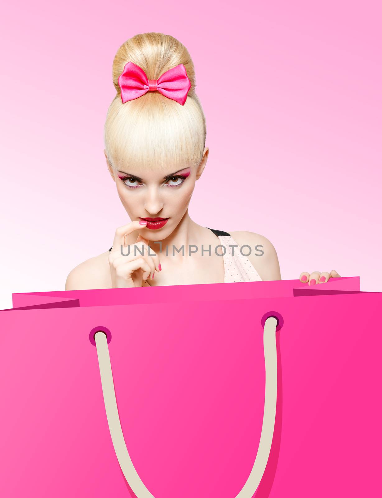 Fashion beauty portrait of woman with huge shopping bag waiting for presents on pink background, people, copyspace. Confident blonde girl with Pinup hairstyle, fringe and pink bow. Billboard