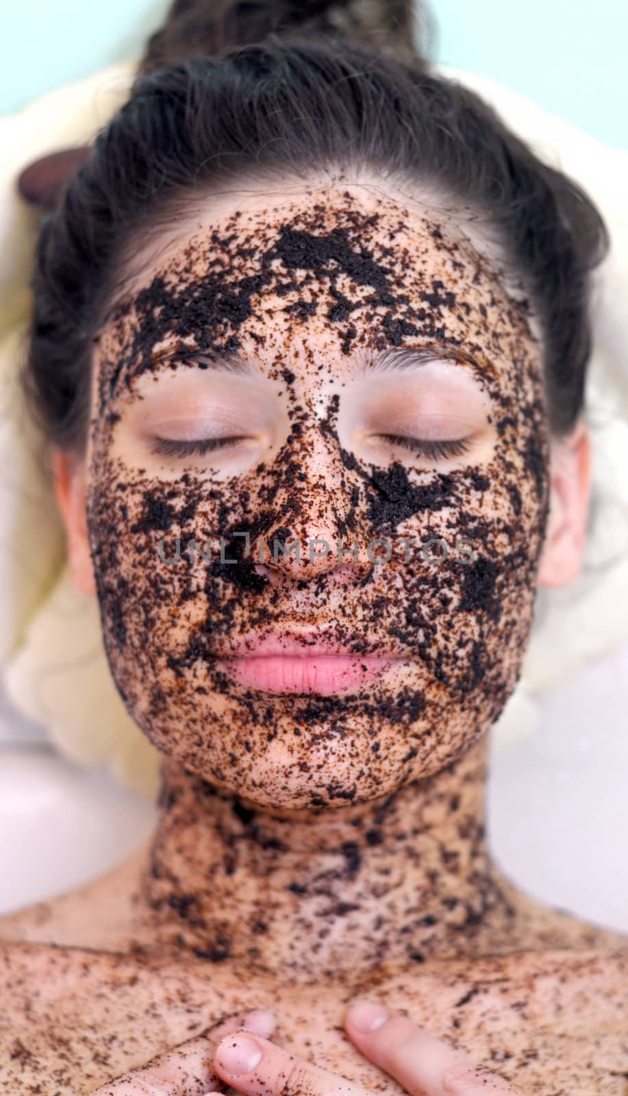 portrait of a girl with eyes closed in a cosmetic mask of coffee by vlaru