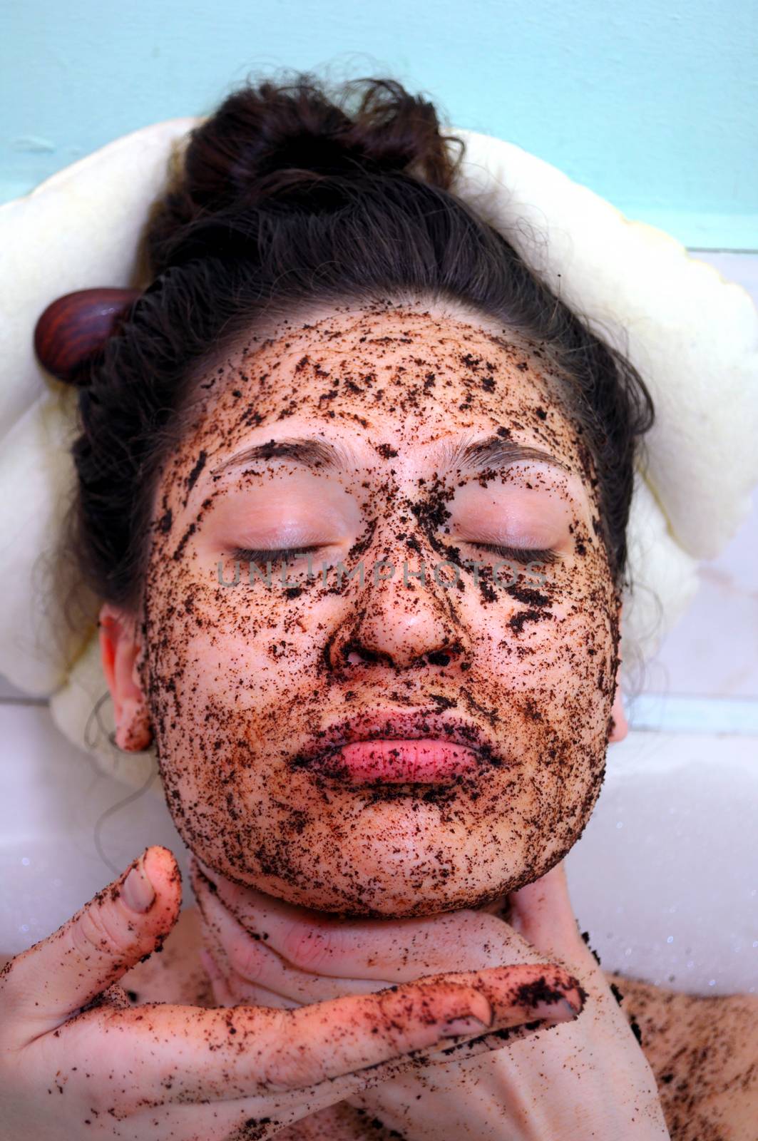 portrait of a girl with eyes closed in a cosmetic mask of coffee by vlaru