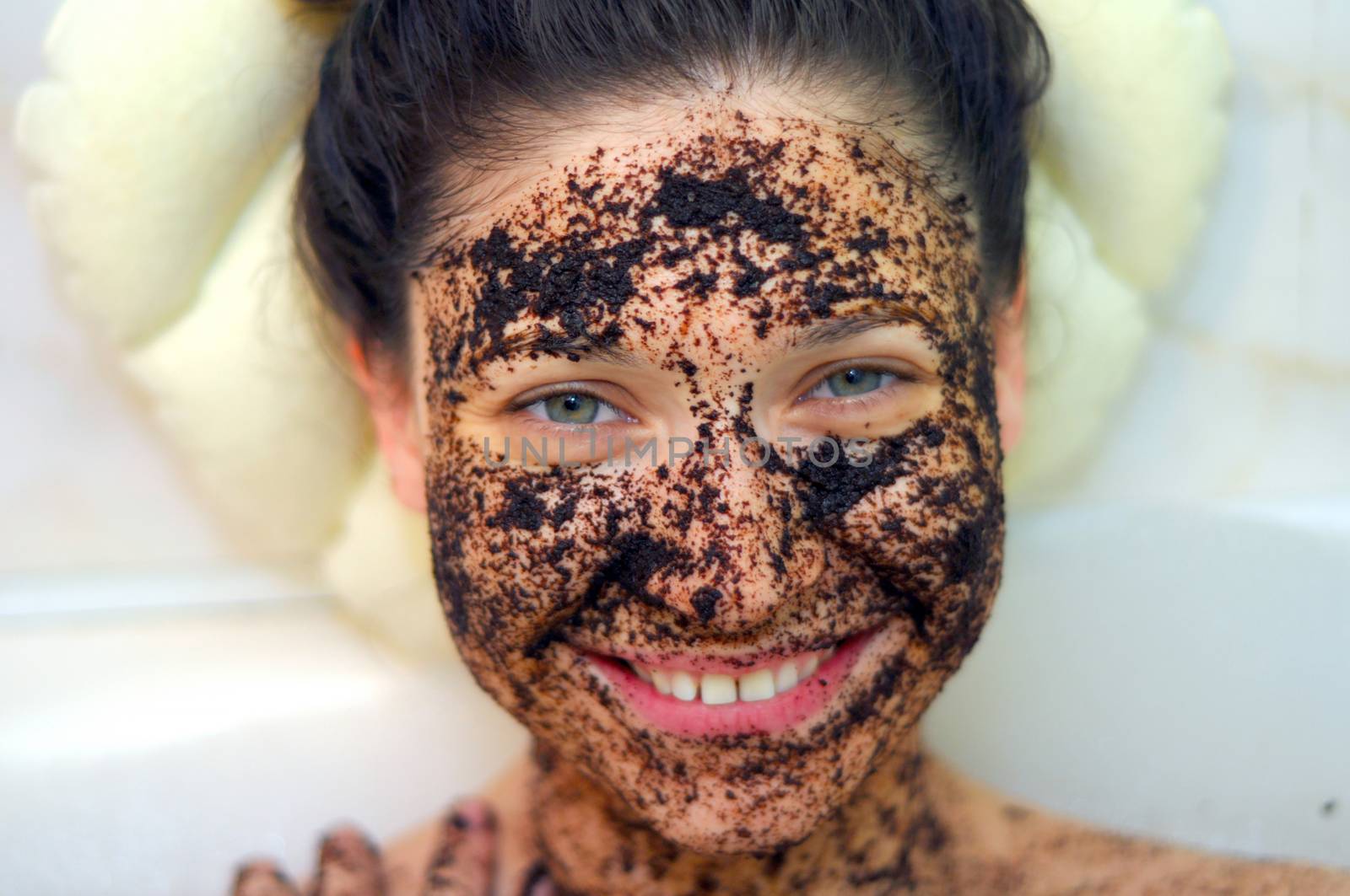 portrait of a girl with eyes closed in a cosmetic mask of coffee