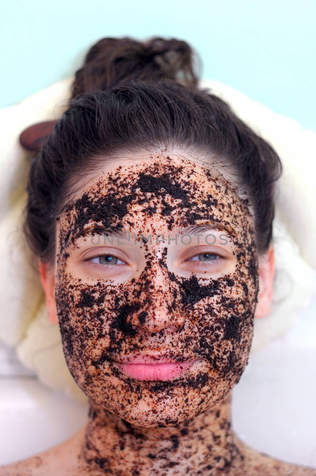 portrait of a girl with eyes closed in a cosmetic mask of coffee by vlaru