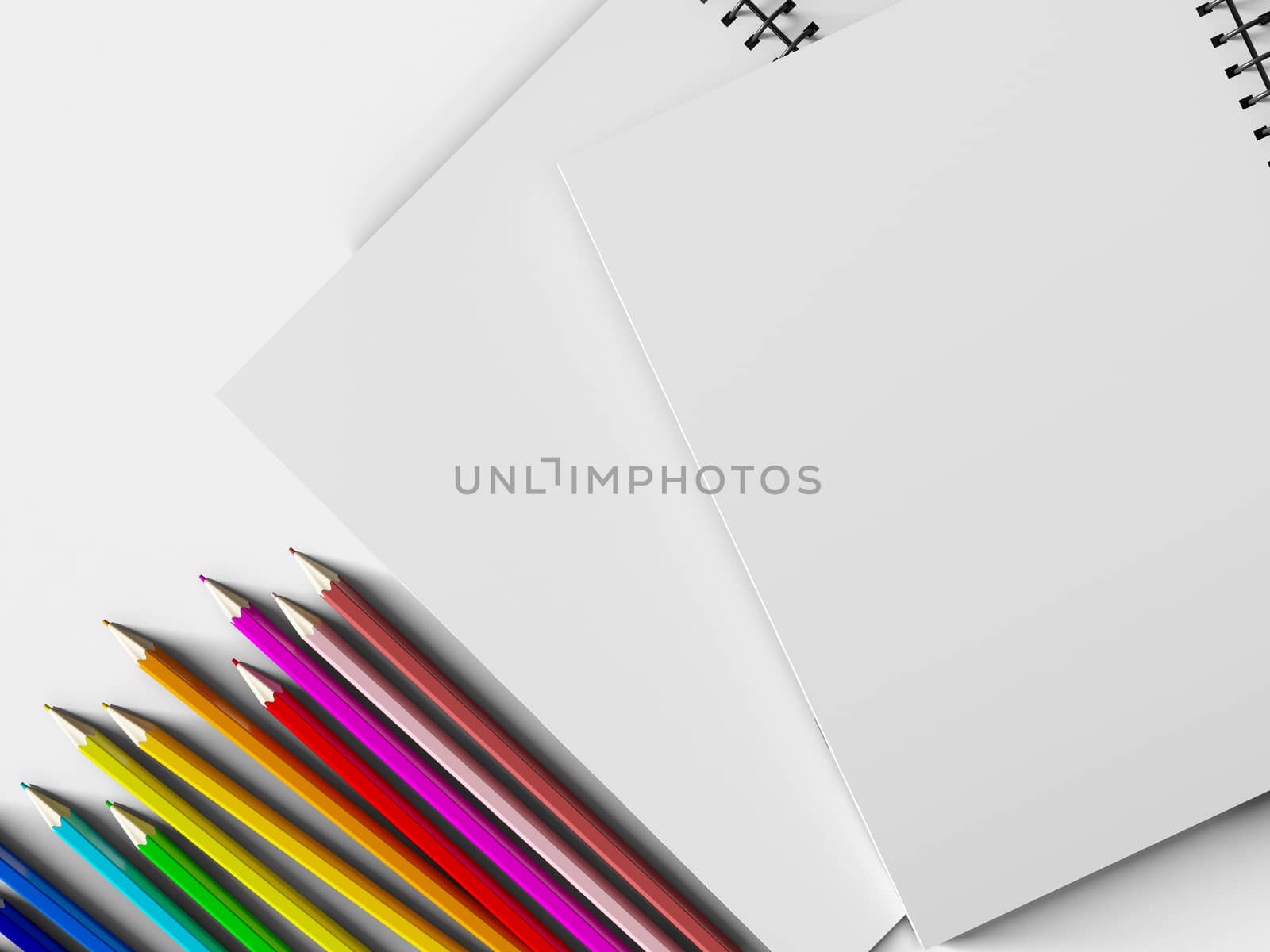 notebook with colored pencils on White background by teerawit