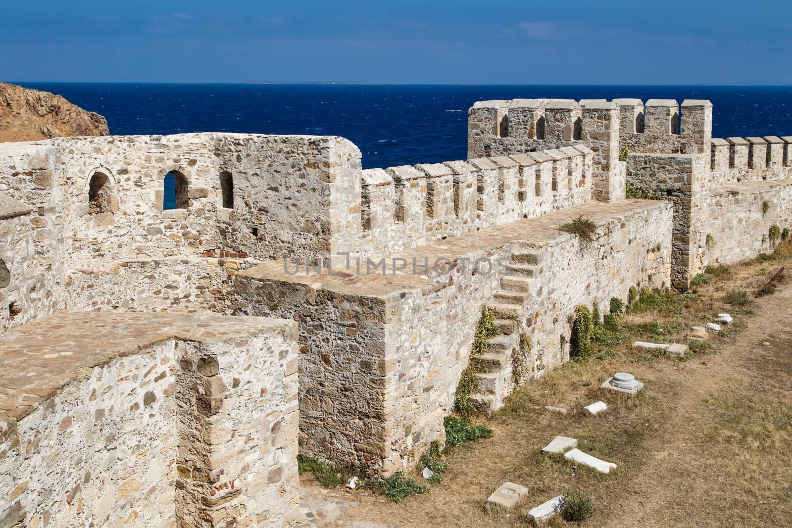 Medieval castle in Tenedos, Bozcaada, Turkey at seacoastline.