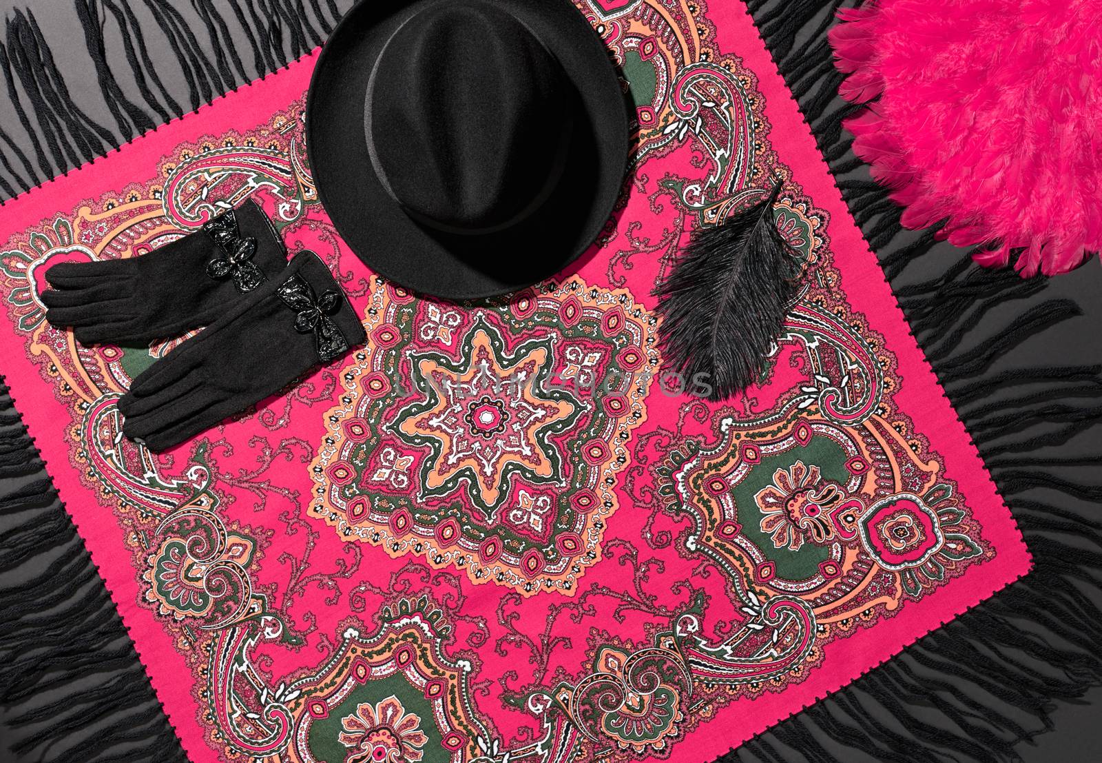 Fashion clothes stylish set, colored shawl, accessories. Ethnic traditional pattern pink cashmere wool headscarf, trendy black hat, gloves, feather.Unusual creative elegant.Autumn winter.Vintage retro