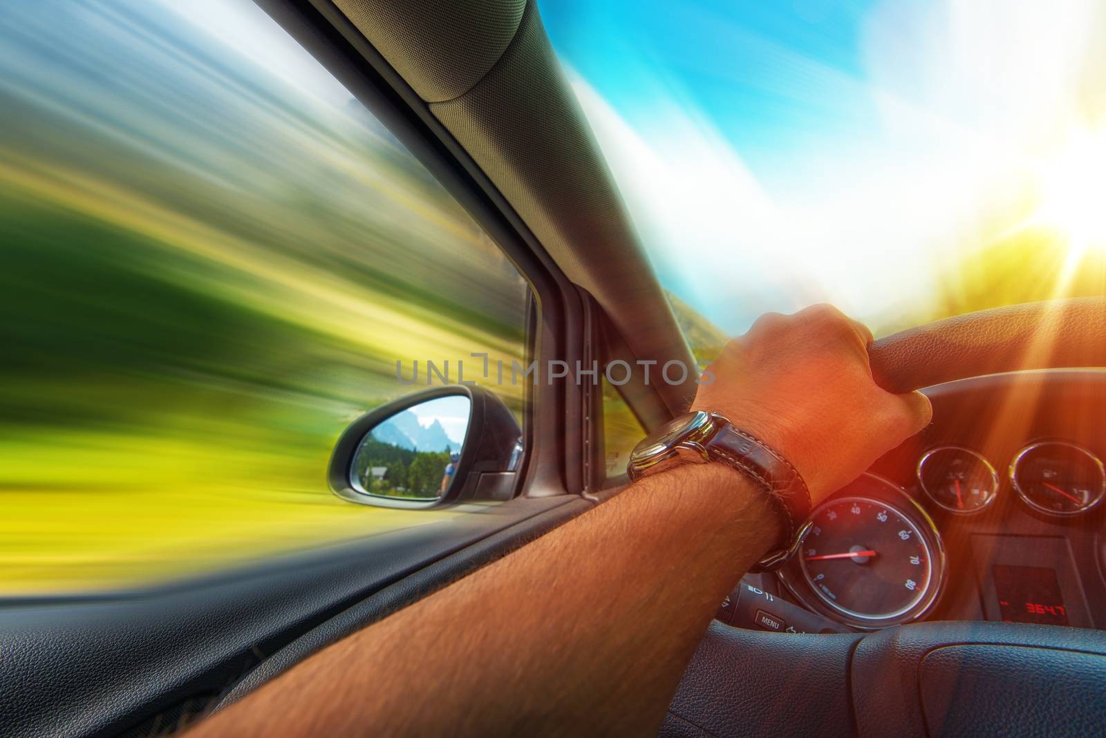 Fast Car Driving Photo Concept. Vehicle Traveling.