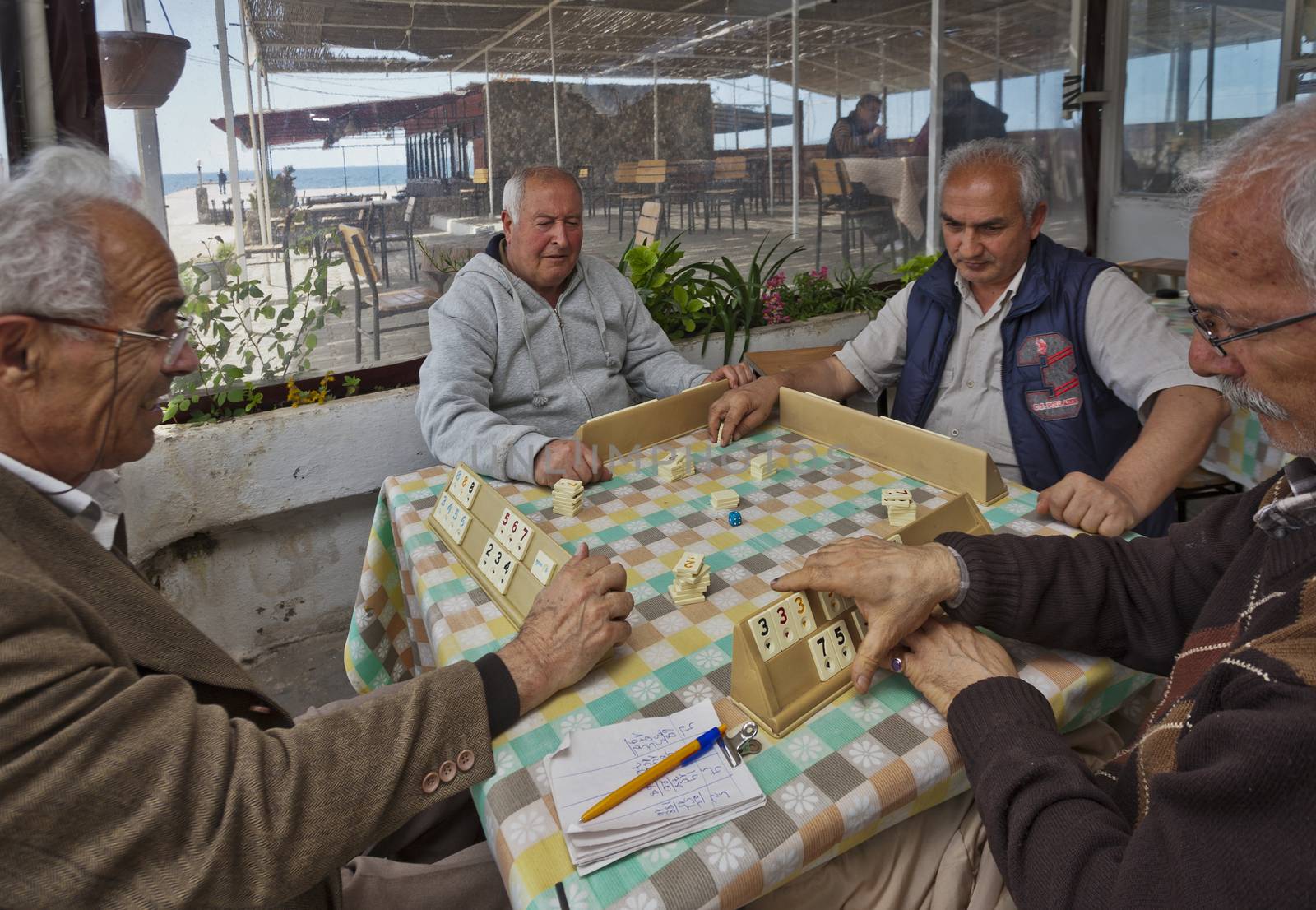 ISTANBUL, TURKEY – APRIL 23: Unidenified men playing a tile game near the seaside prior to Anzac Day on April 25, 2012 in Istanbul, Turkey. 