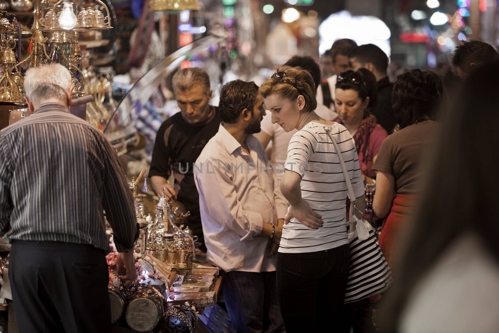 ISTANBUL, TURKEY – APRIL 25: Unidenified shopper in the Istanbul spice market vendor prior to Anzac Day on April 25, 2012 in Istanbul, Turkey. 