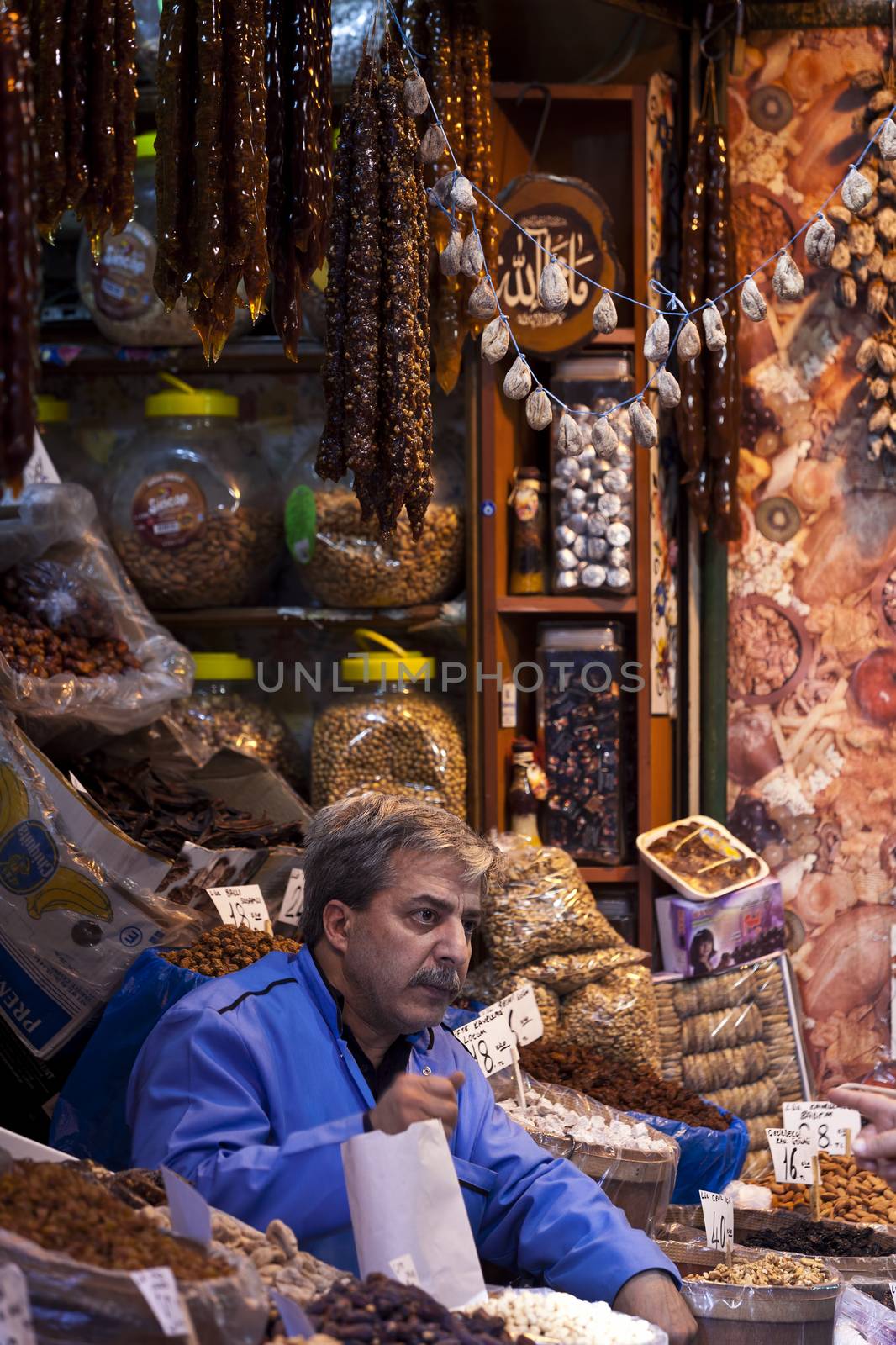 ISTANBUL, TURKEY – APRIL 25: Unidenified Istanbul spice market vendor prior to Anzac Day on April 25, 2012 in Istanbul, Turkey. 