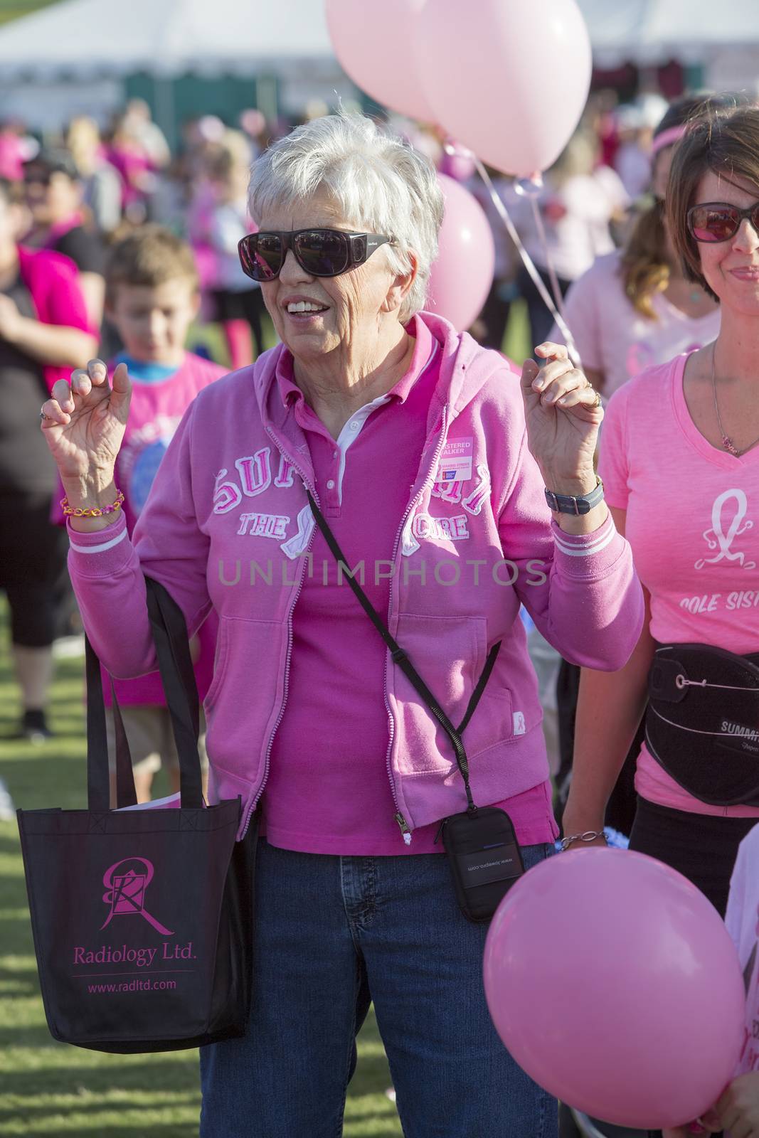 TUCSON, PIMA COUNTY, ARIZONA, USA - OCTOBER 18:  Unidentified mature woman in the crowd prior to the 2015 American Cancer Society Making Strides Against Breast Cancer walk, on October 18, 2015 in Tucson, Arizona, USA.