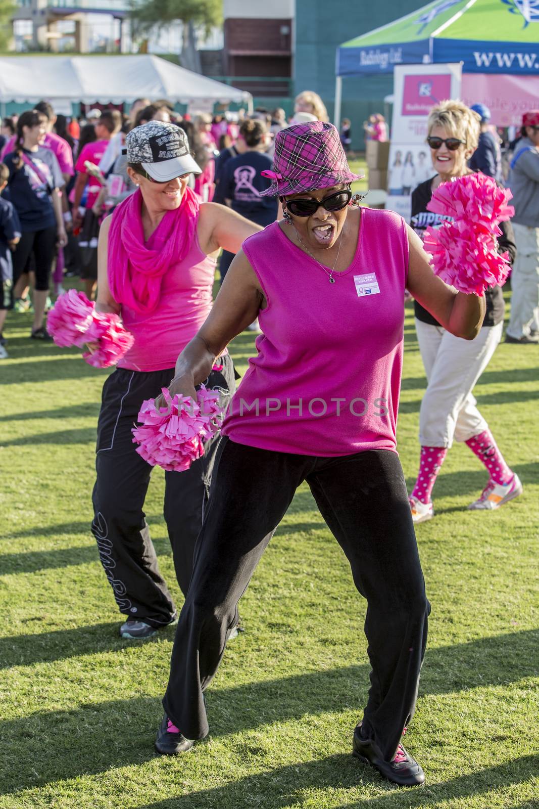 TUCSON, PIMA COUNTY, ARIZONA, USA - OCTOBER 18:  Unidentified women dancing before the 2015 American Cancer Society Making Strides Against Breast Cancer walk, on October 18, 2015 in Tucson, Arizona, USA.