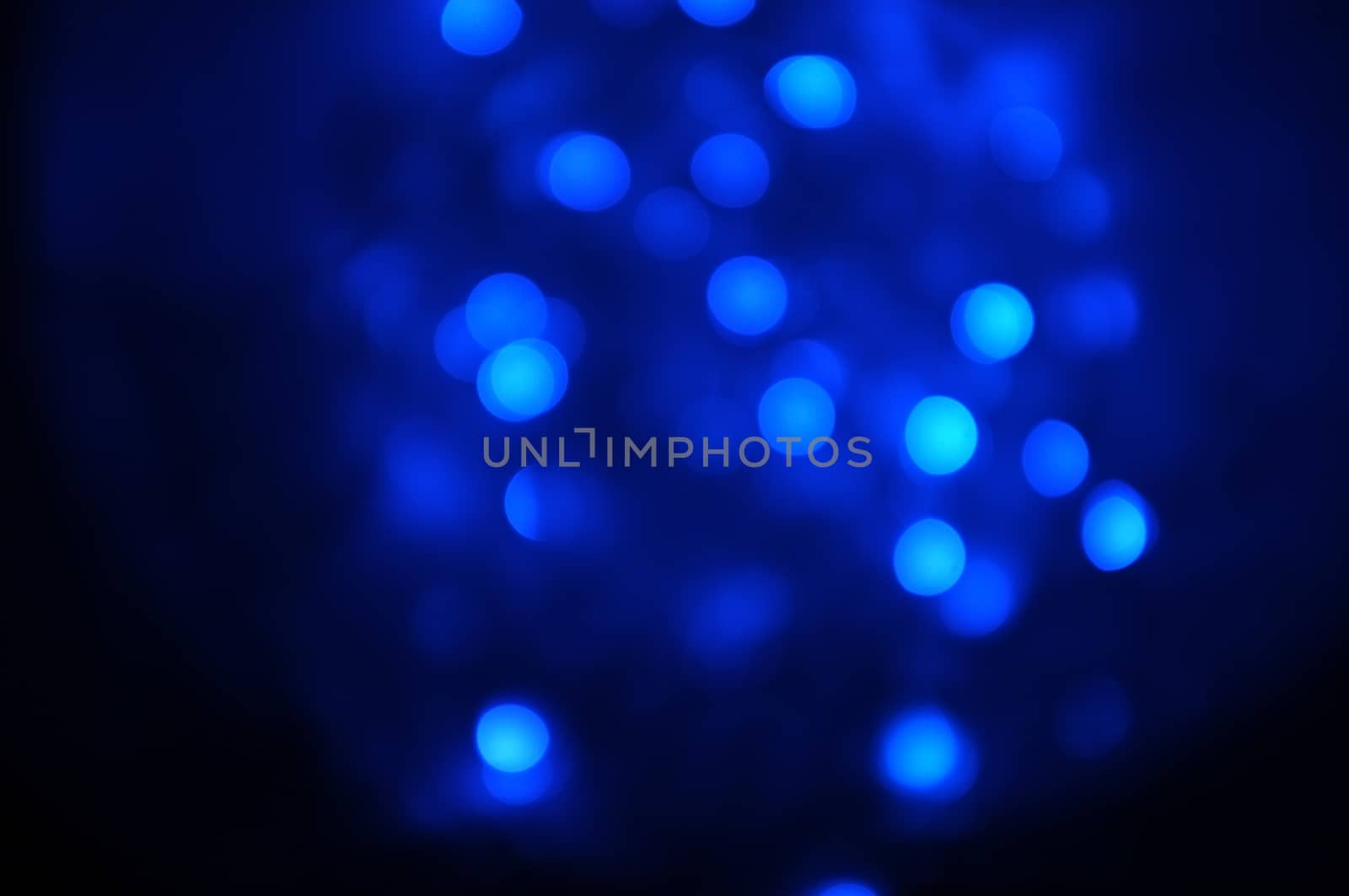 Abstract light blue bokeh, light violet bokeh, light purple bokeh in the dark background by Hepjam