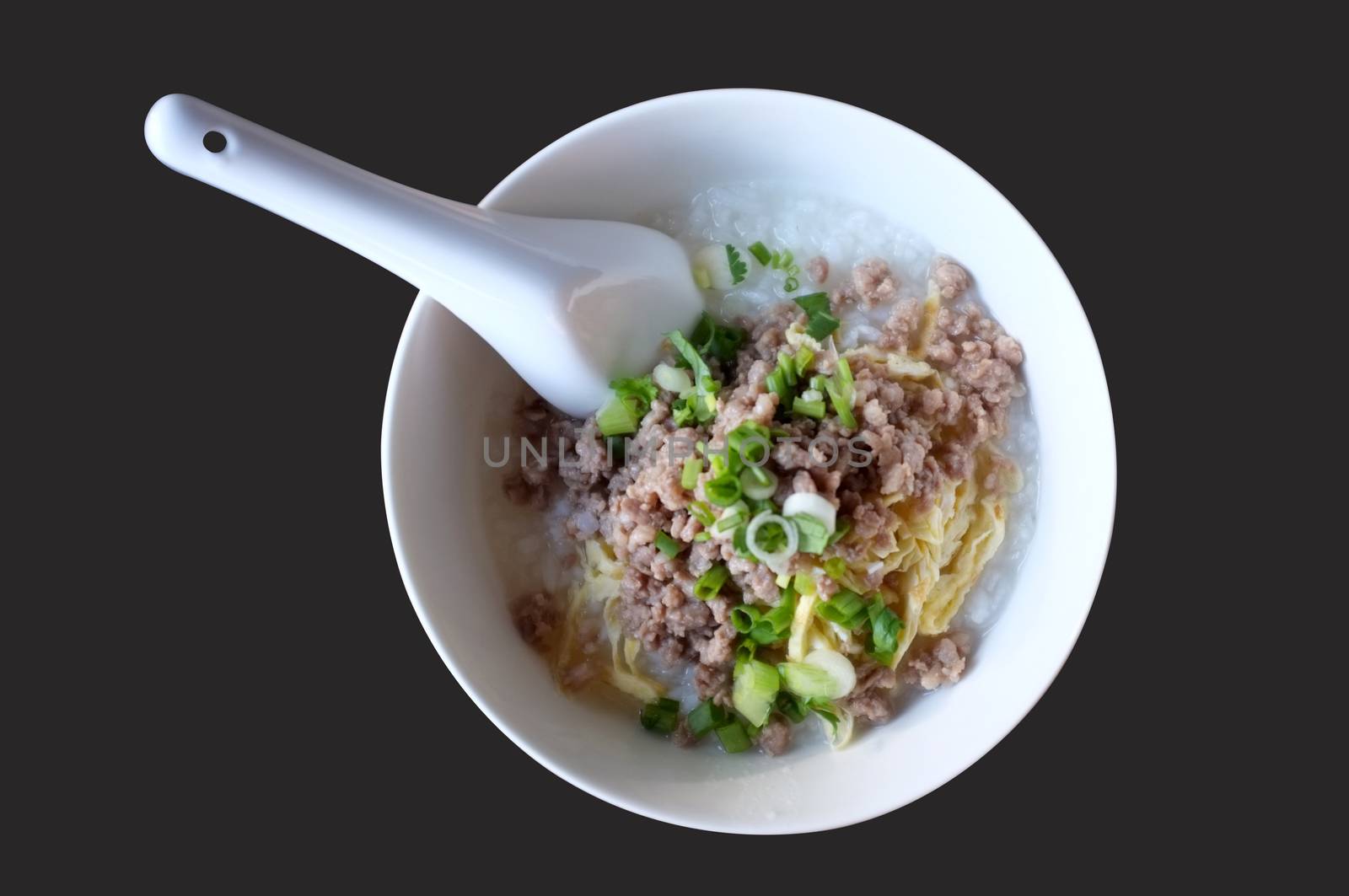 Soft boiled rice with mince pork, Congee in white bowl by Hepjam
