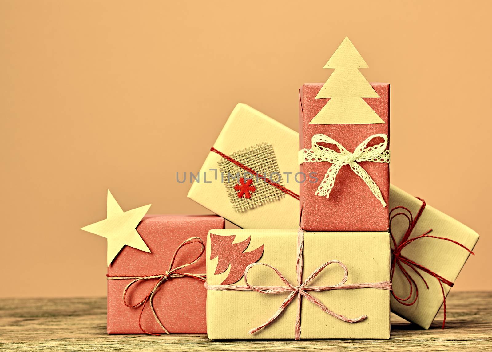 Gift boxes, Christmas decorations. Star, fir tree made paper. Greeting card, handmade, closeup