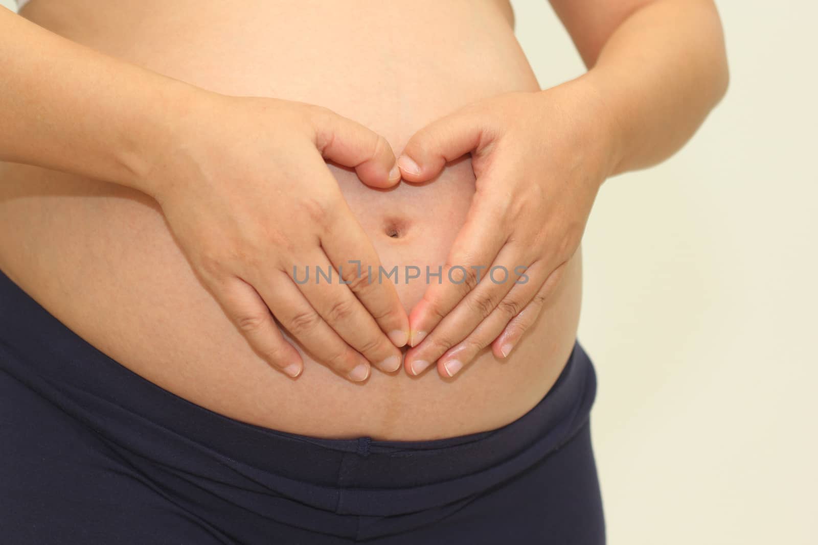 Photo of a cute pregnant woman belly