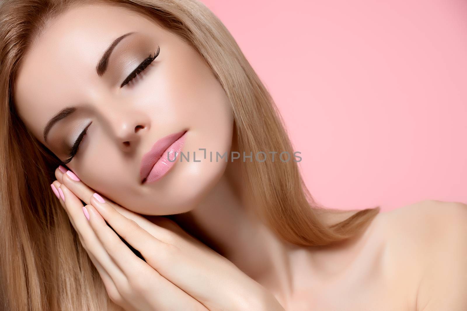 Beauty portrait woman with eyes closed, sleeping. Sensual attractive pretty nude blonde model girl dreaming on pink, shiny straight hair. People face closeup, natural makeup, perfect skin, copyspace